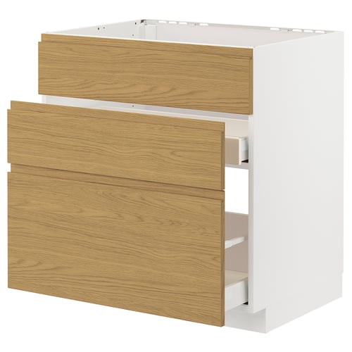 White METOD kitchen cabinet with oak drawers.
