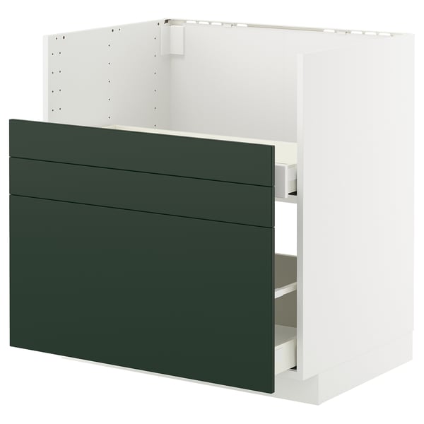 Modern green kitchen cabinet with three drawers and sleek lines.