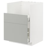 Modern kitchen unit with light grey havstorp fronts, sleek design, and metallic accents.