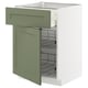 Green-grey kitchen cabinet unit with two wire baskets, partially open door.