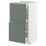 An IKEA METOD kitchen cabinet with grey-green bodarp fronts, offering a modern, sleek design with two drawers and a door.