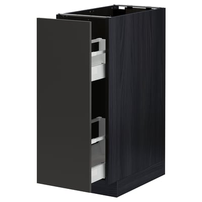 Black METOD kitchen cabinet with drawers, sleek design and white interiors.