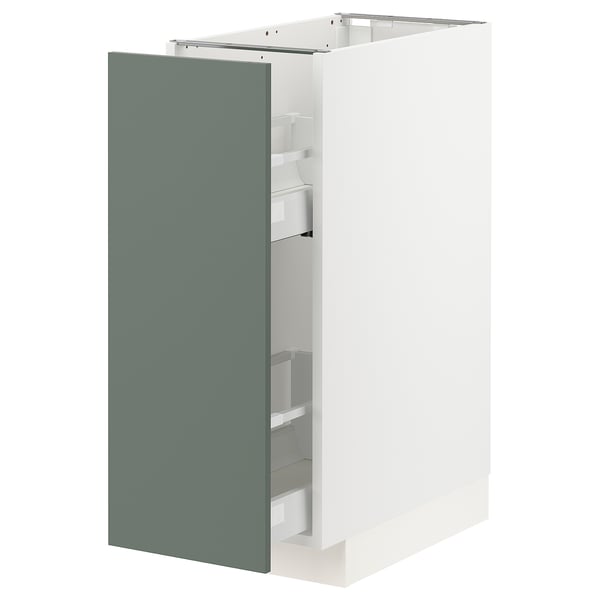 Depicts a modern kitchen cabinet from the METOD system, featuring a tall, rectangular shape with a greenish-gray door and white interior compartments.