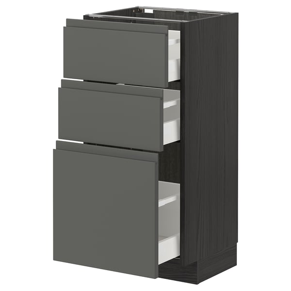 Modern kitchen cabinet with dark grey drawers and metal handles, offering sleek and organized storage.
