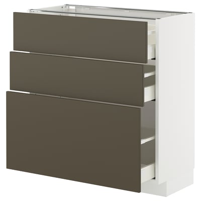A white METOD kitchen cabinet with three dark brown drawers and a shelf on top.