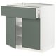 Modern green-grey kitchen unit with drawer and shelves.