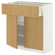 A white METOD kitchen unit with light wood drawers and shelves, featuring a modern design with a sleek and clean look.