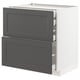 A white METOD kitchen cabinet with dark grey drawers. It has two large drawers with a classic design, set against a white frame. Sturdy and modern.