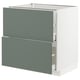 IKEA METOD kitchen unit with gray-green drawers and white frame.