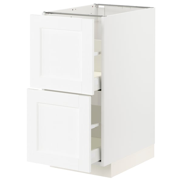 A white METOD kitchen cabinet with two drawers and a cabinet door, featuring a sleek, modern design.