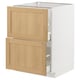 An ikea METOD kitchen cabinet with white and oak veneer drawers.