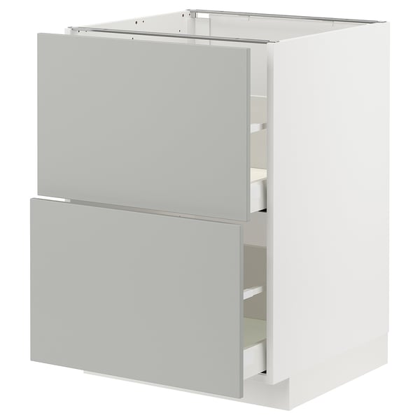A modern white METOD kitchen cabinet with light grey havstorp drawers and doors, featuring a sleek design and clean lines.