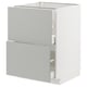 A modern white METOD kitchen cabinet with light grey havstorp drawers and doors, featuring a sleek design and clean lines.
