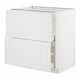 A white METOD kitchen cabinet with a crafted design and wooden texture.