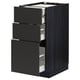 METOD kitchen unit in black with three open drawers, modern design, dark wood grain pattern.
