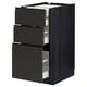Modern black METOD kitchen cabinet with three open drawers, sleek design, sturdy particleboard and steel.