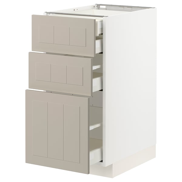 Modern white-beige kitchen cabinet with pull-out drawers, beadboard design.