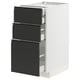 Modern kitchen cabinet, white and black, three drawers, sleek design.