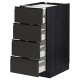 Modern black kitchen unit with four partially open drawers, sleek edges, and integrated handles.