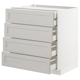 White METOD kitchen cabinet with four beveled gray drawers.