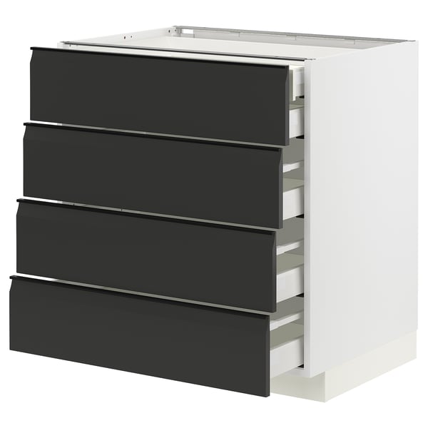Modern kitchen unit: METOD base in white with four matte black drawers, sleek integrated handles.
