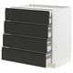 Modern kitchen unit: METOD base in white with four matte black drawers, sleek integrated handles.