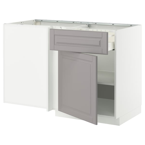 A white METOD kitchen cabinet with grey bodbyn handles and a single door open.