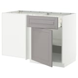 A white METOD kitchen cabinet with grey bodbyn handles and a single door open.
