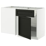 A white and black kitchen cabinet from the METOD system. It a drawer and a door, with a traditional black-stained lerhyttan design.