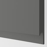 Modern dark grey kitchen cabinet with sleek, seamless design and integrated handle.