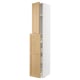 White and light wood cabinet with door open.