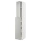 Displays a white METOD kitchen cabinet system with grey havstorp fronts. The cabinet is tall with two sections and a modern, clean design.