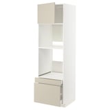 A white METOD kitchen cabinet with beige havstorp handles, featuring drawers and adjustable shelves.