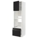 A tall white kitchen cabinet with black accents, featuring open shelves and drawers with sleek matte black handles.