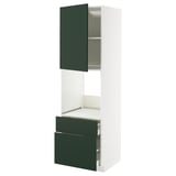 A modern white kitchen cabinet with dark green drawer and door accents. It an open cabinet with drawers and shelf space.