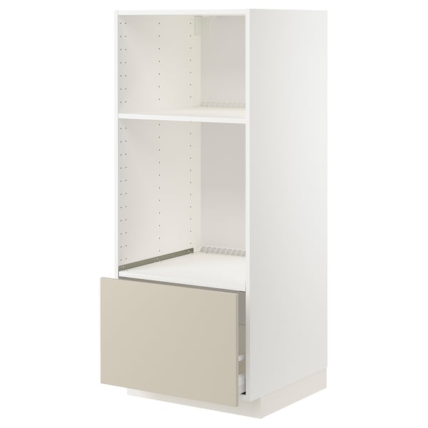 This image shows a white METOD kitchen cabinet with a beige drawer. The cabinet adjustable shelves and a sturdy, modern design with clean lines.