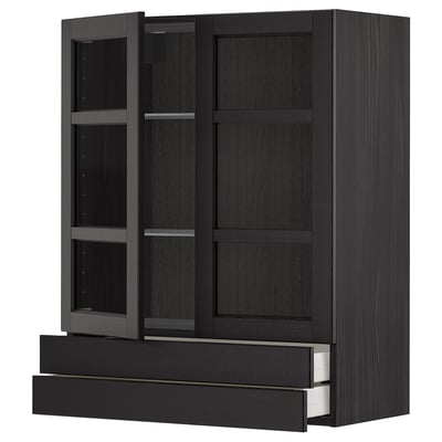 Black METOD kitchen cabinet with glass doors and drawers. Modern, sturdy design for storage.