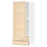 A modern light ash-colored kitchen cabinet system with a single door and drawer. It has a sleek, simplistic design and is part of the METOD series.