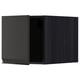 A modern black kitchen cabinet with a sleek, handle-less design.