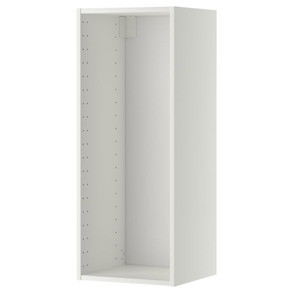 A white METOD wall cabinet with a rectangular shape and perforated back panel, designed for kitchen storage.