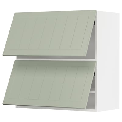 Displays two light green METOD kitchen wall cabinets from the stensund series. They are rectangular with vertical grooves and panelled doors.