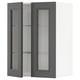 A dark grey METOD kitchen wall cabinet with clear glass doors displaying an open shelf inside.