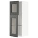 A grey METOD kitchen cabinet with glass doors and adjustable shelves.