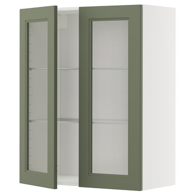 Wall-mounted green glass-door cabinet with adjustable shelves.