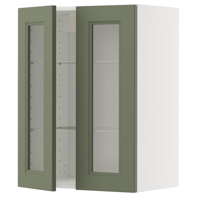 Green kitchen cabinet with glass door & shelves.