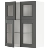 A dark grey IKEA METOD kitchen cabinet with glass doors. It has a modern design with square shapes and adjustable shelves.