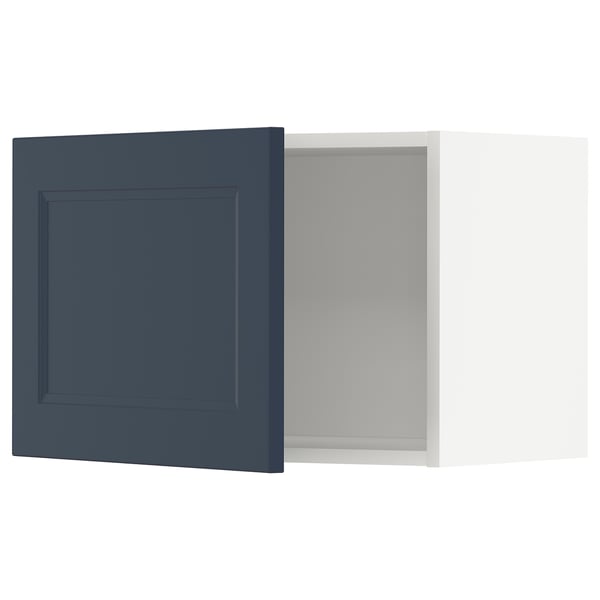 Blue METOD kitchen cabinet with white interior.