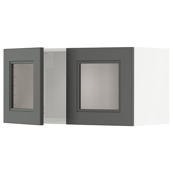 Two grey kitchen cabinet doors, one open, revealing an interior; sleek, modern design with a central panel.