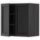 Black wooden kitchen cabinet with open door, dark interior, and adjustable shelves.