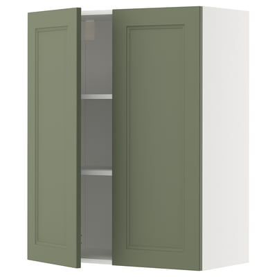 Green kitchen cabinet with one door open, showing adjustable shelf.